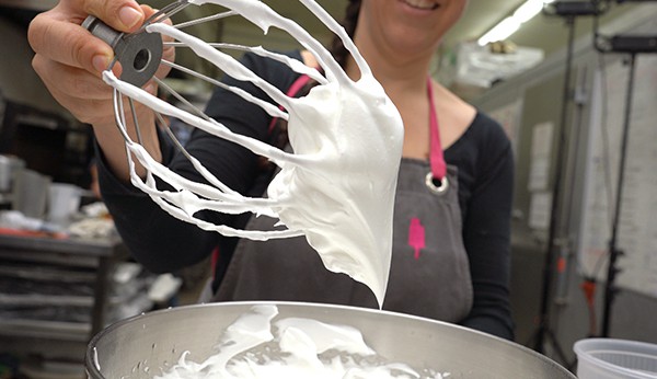 Chef Fany Gerson holds a beater with egg whites